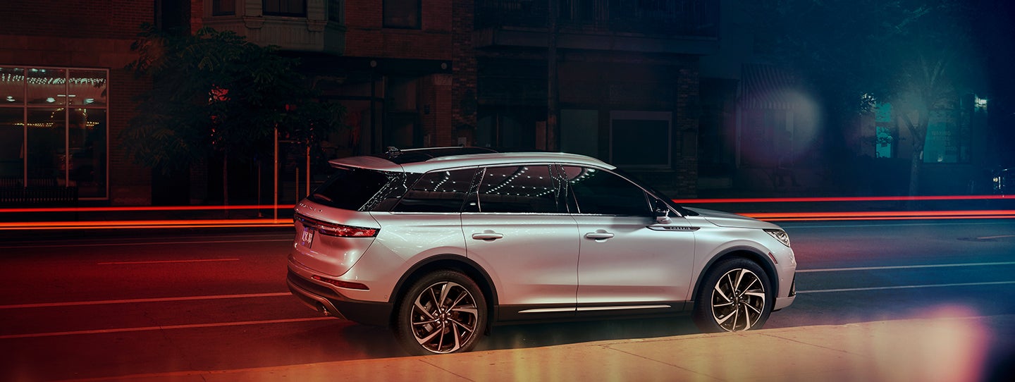 The 2024 Lincoln Corsair® SUV is parked on a city street at night. | Sheehy Lincoln of Richmond in Richmond VA